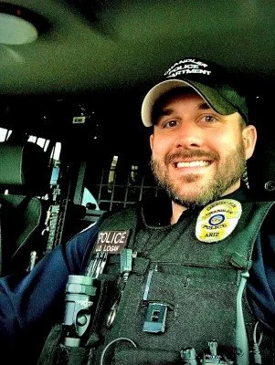 Josh Logan of Guardian Training and Consulting in a police vehicle